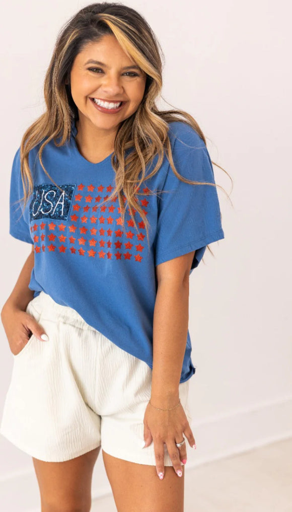 Blue Notched V-Neck Glitter “USA” T-Shirt w/ Short Sleeves by Southern Grace.
