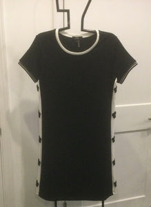 Black Round Neck Knit Dress w/Cap Sleeves and White Trim on Neck and Sides. Panels have Black Daisy Inserts by Orly.